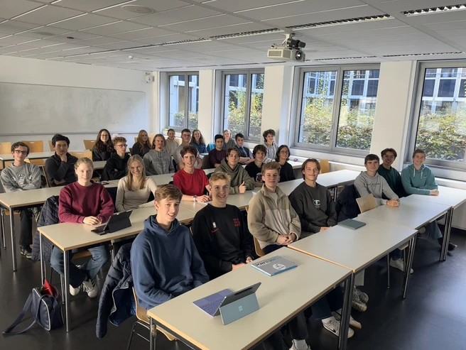 Color photo of a classroom filled with young people